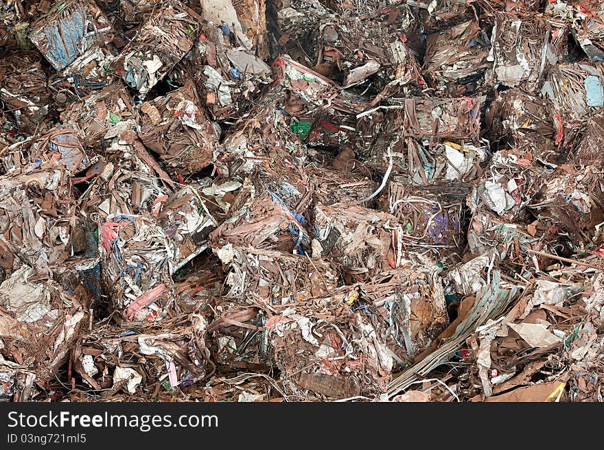 Stack of waste before shredding at recycling yunkyard. Stack of waste before shredding at recycling yunkyard