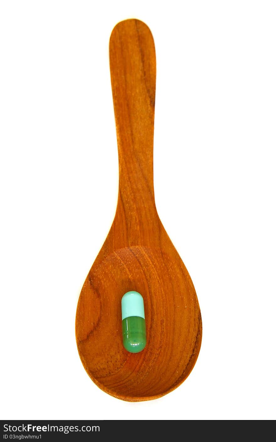 Wooden Spoon With Capsule  Isolated