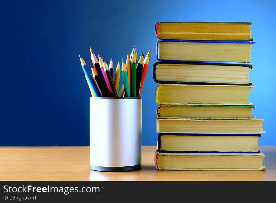 Pencils And Books Are On The Table