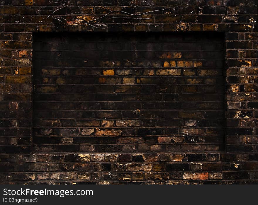 Old weathered brick wall, rectangular recess. Old weathered brick wall, rectangular recess