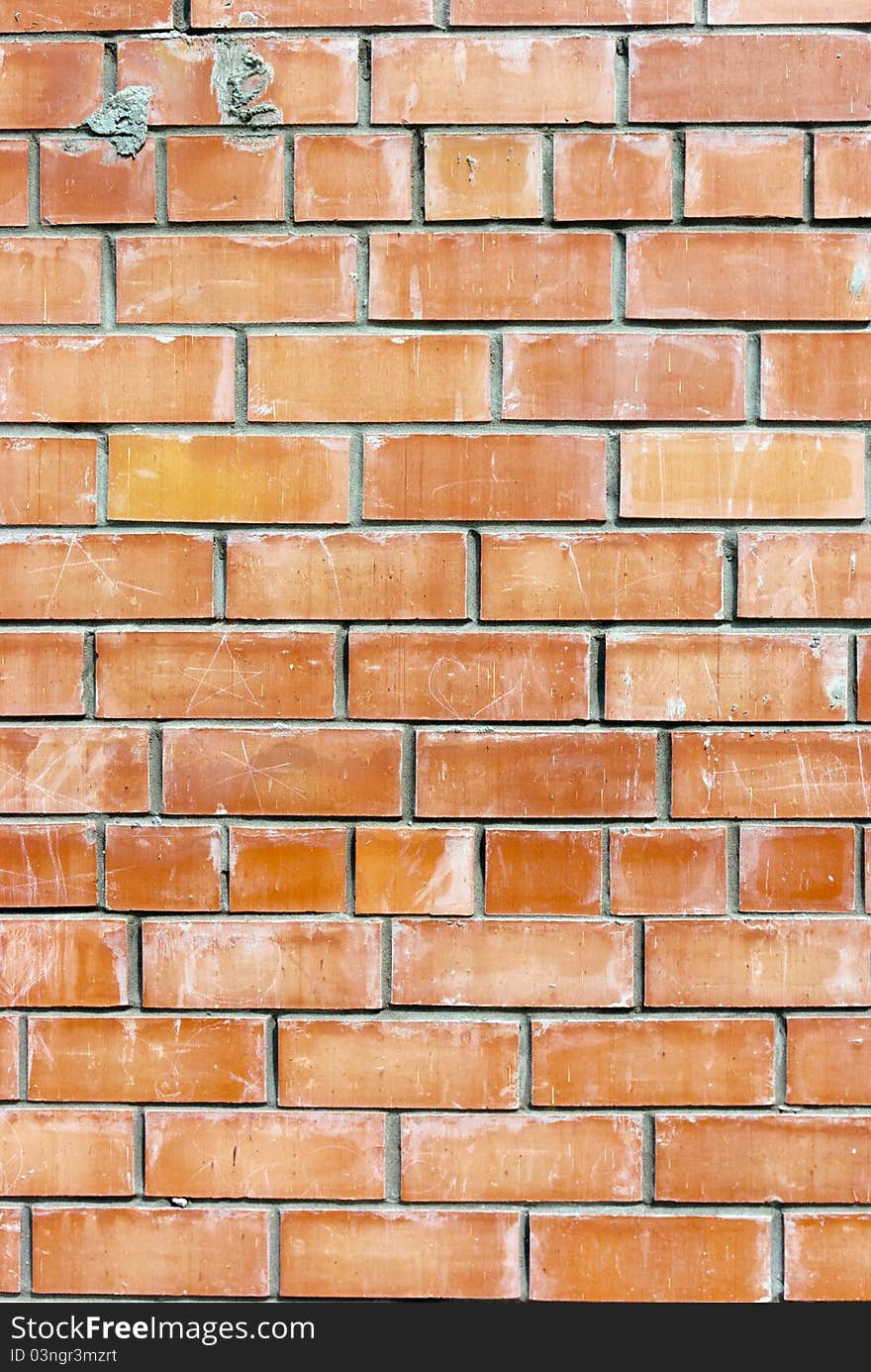 Old weathered stained red brick wall background