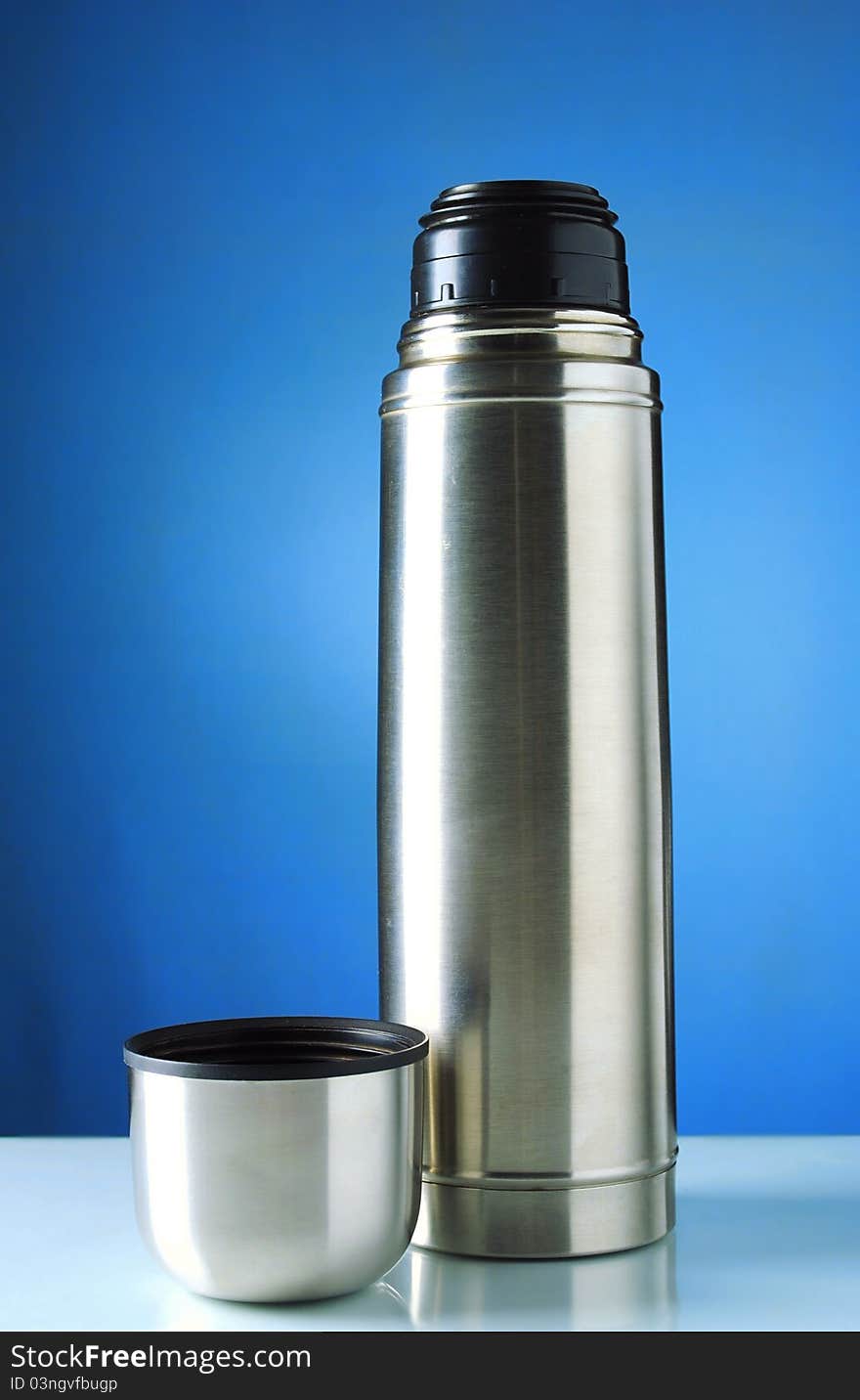 Thermos Silver On A Blue Background