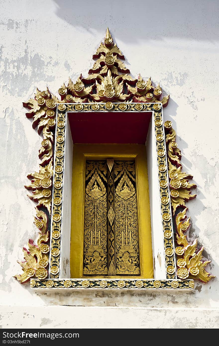 The old Thai architecture from the golden window of 200 years old Thai Temple. The old Thai architecture from the golden window of 200 years old Thai Temple