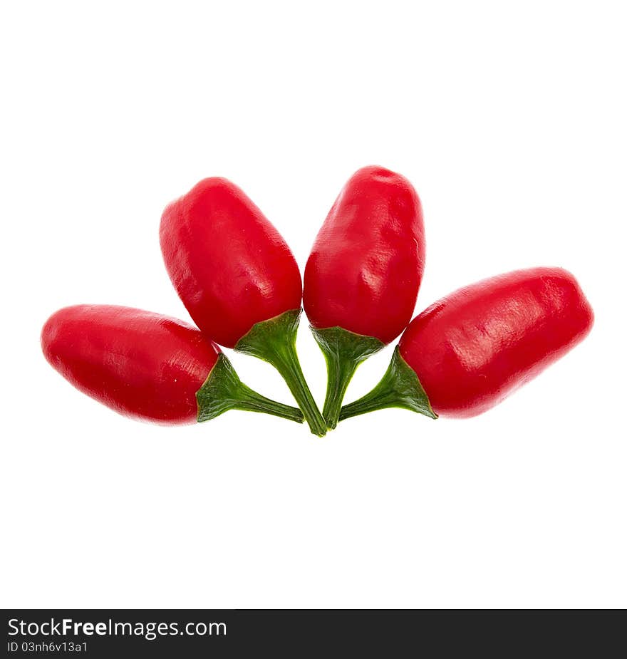 Red hot chilli peppers on white background