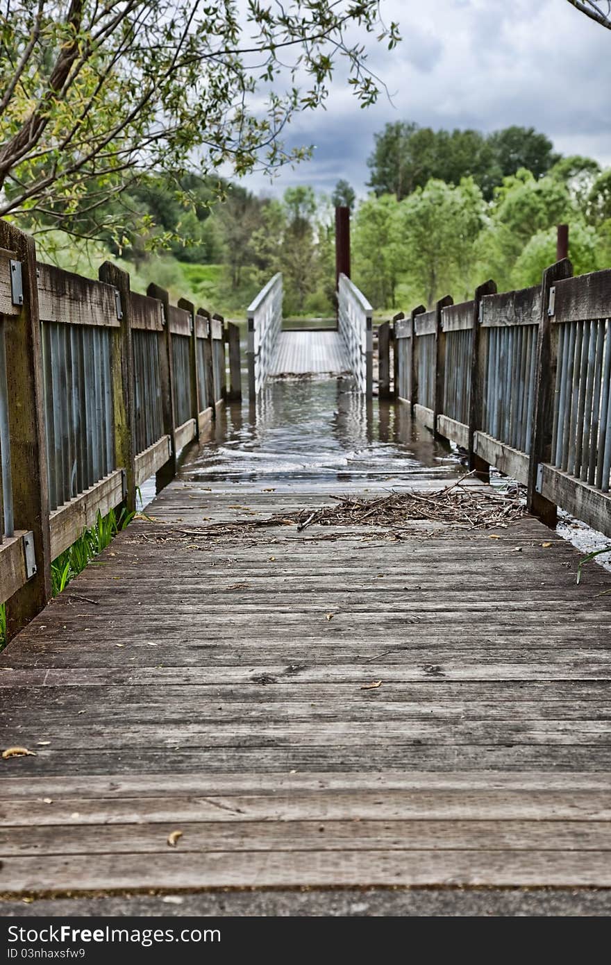 As the snow melt and rains raise the river level the docks begin to flood. As the snow melt and rains raise the river level the docks begin to flood.