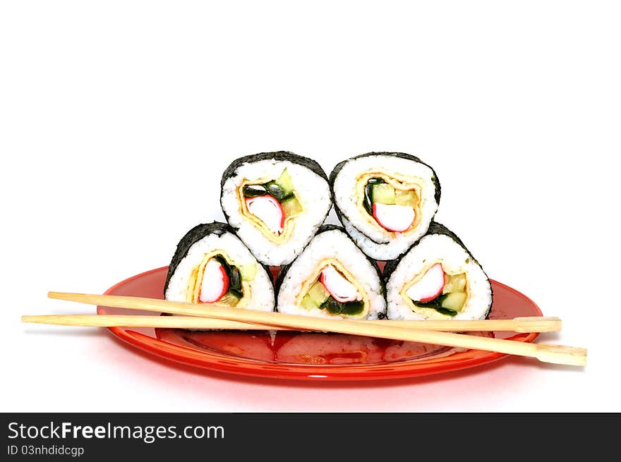 Traditional Japanese sushi on a red plate, isolated on white background. Traditional Japanese sushi on a red plate, isolated on white background