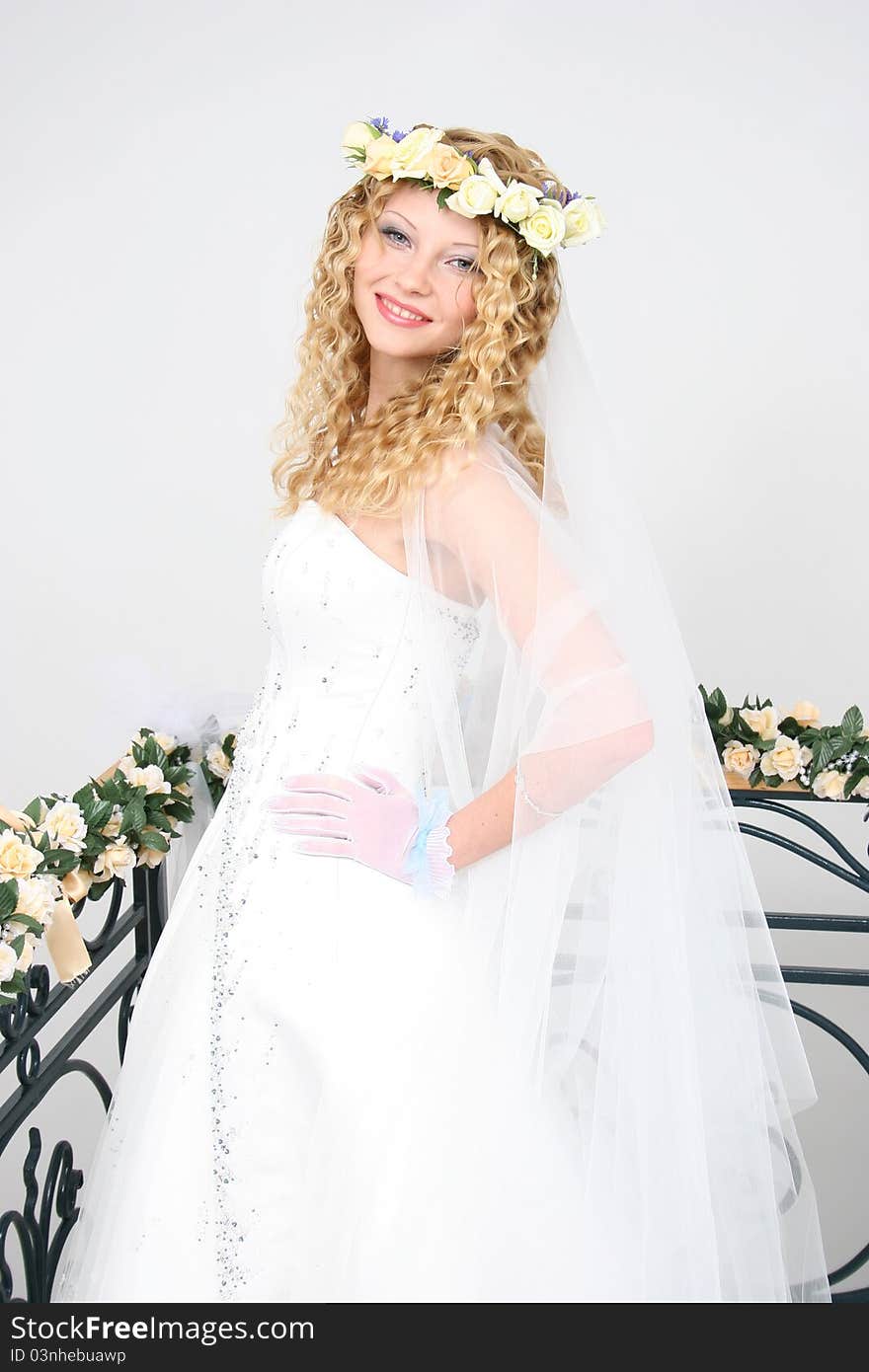 Bride posing in a studio on the wedding day. Bride posing in a studio on the wedding day