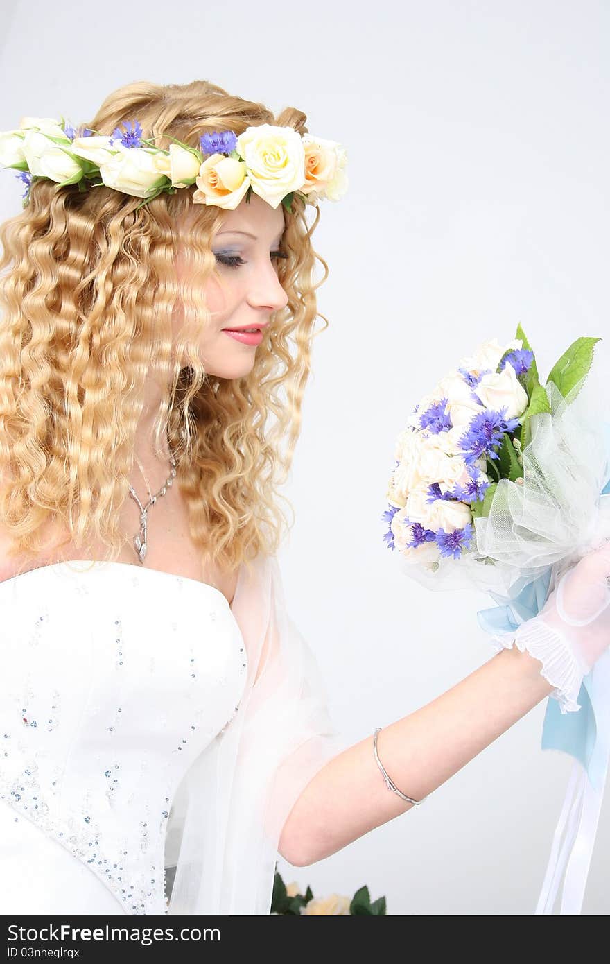 Bride posing in a studio on the wedding day. Bride posing in a studio on the wedding day