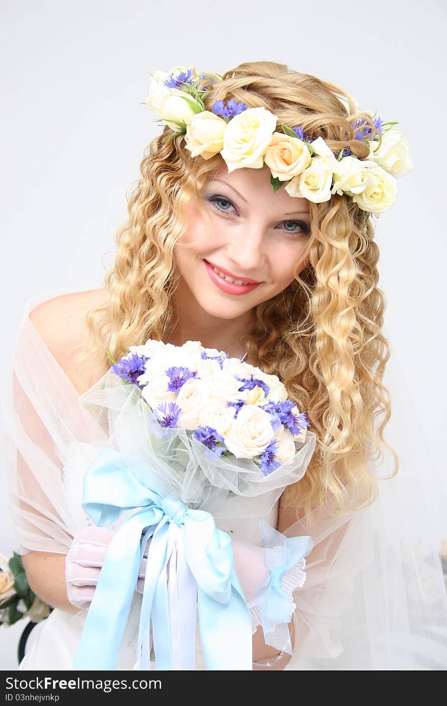 Bride posing in a studio on the wedding day. Bride posing in a studio on the wedding day