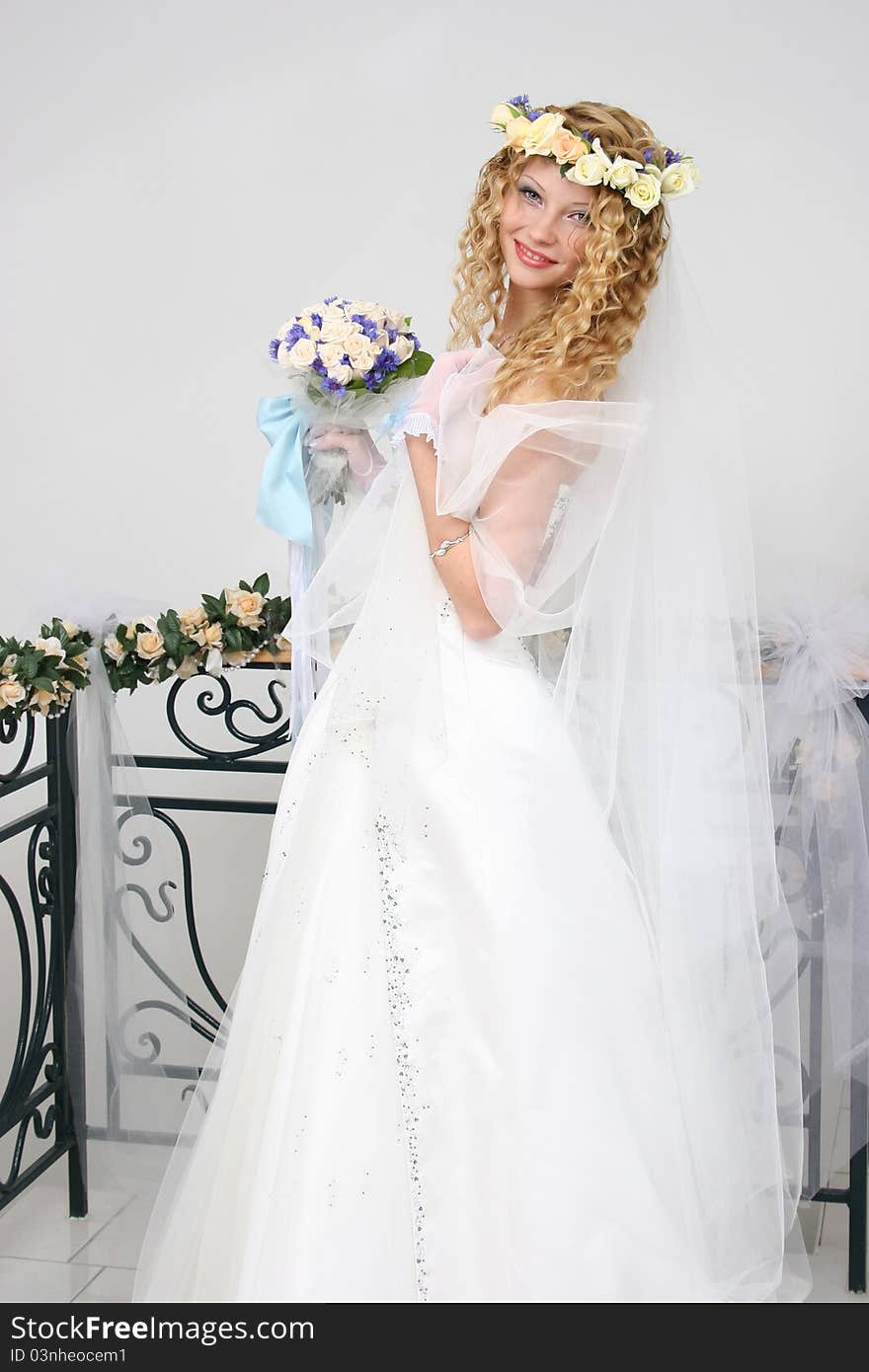 Bride posing in a studio on the wedding day. Bride posing in a studio on the wedding day