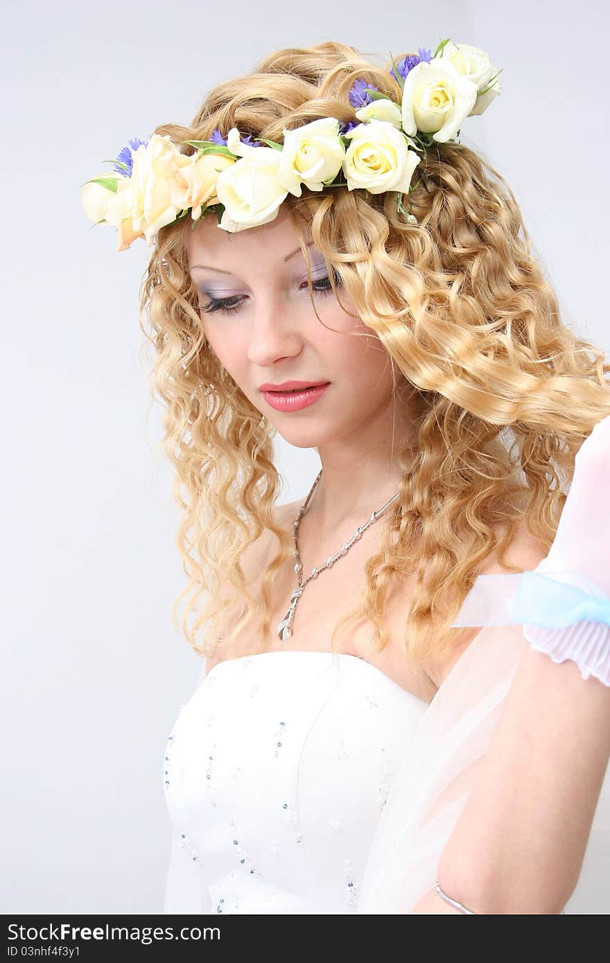 Bride posing in a studio on the wedding day. Bride posing in a studio on the wedding day