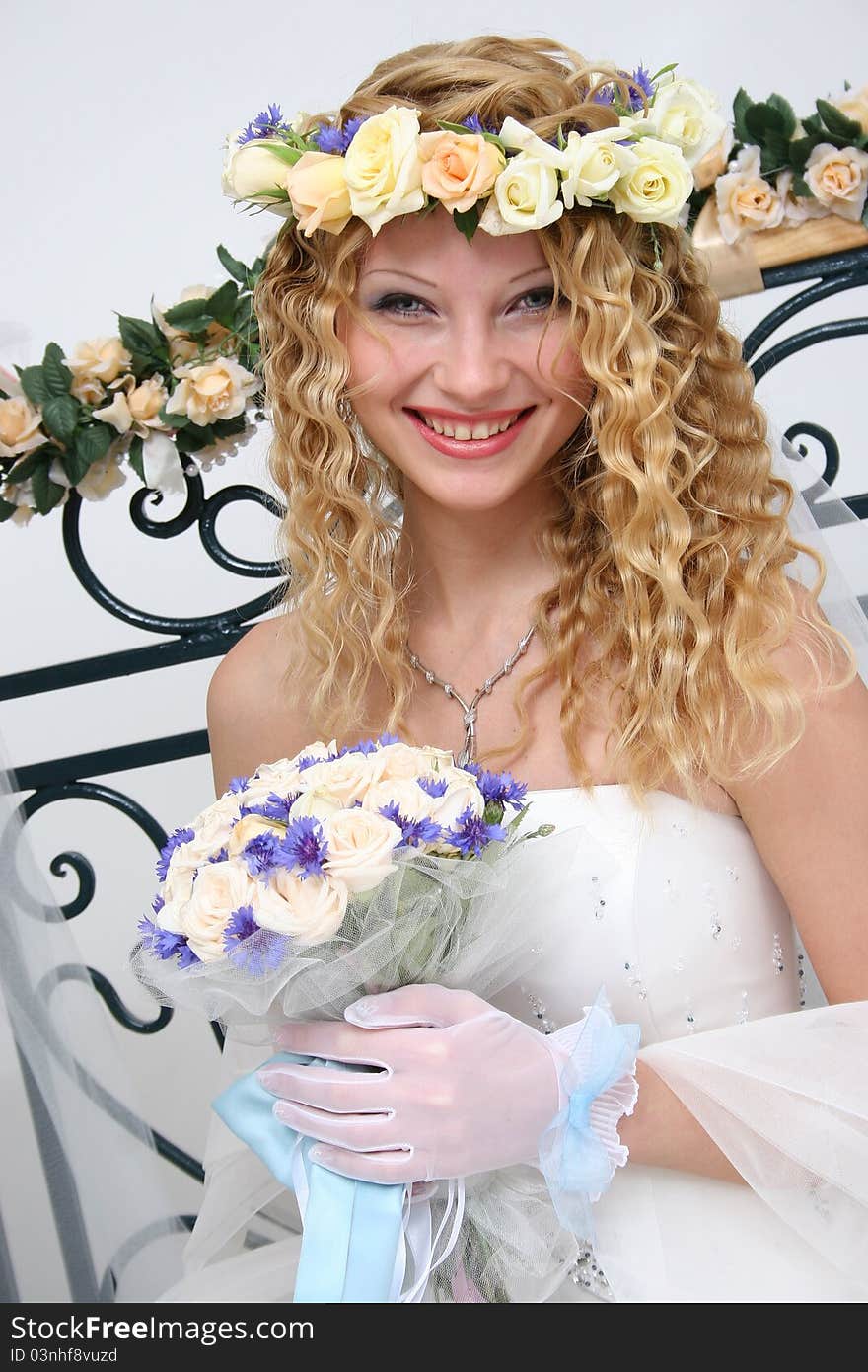 Bride posing in a studio on the wedding day. Bride posing in a studio on the wedding day