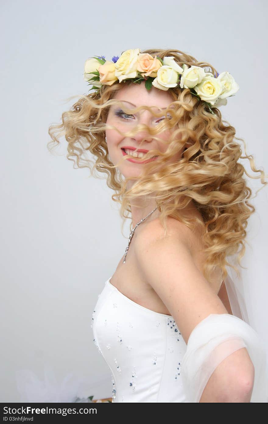 Bride posing in a studio on the wedding day. Bride posing in a studio on the wedding day