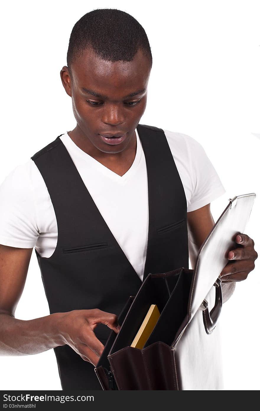 Young and beautiful black man holding a briefcase and papers