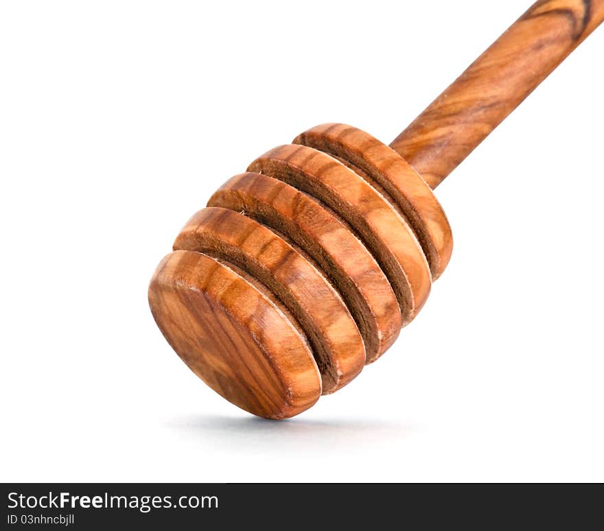 Close-up on bamboo honey dipper over white background