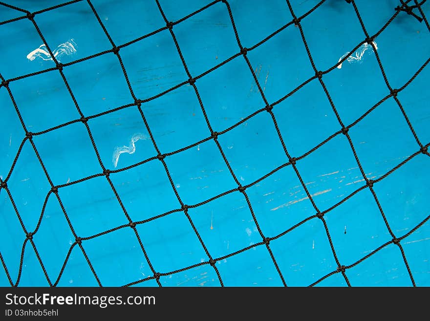 Fisher net against blue background with painted seagulls