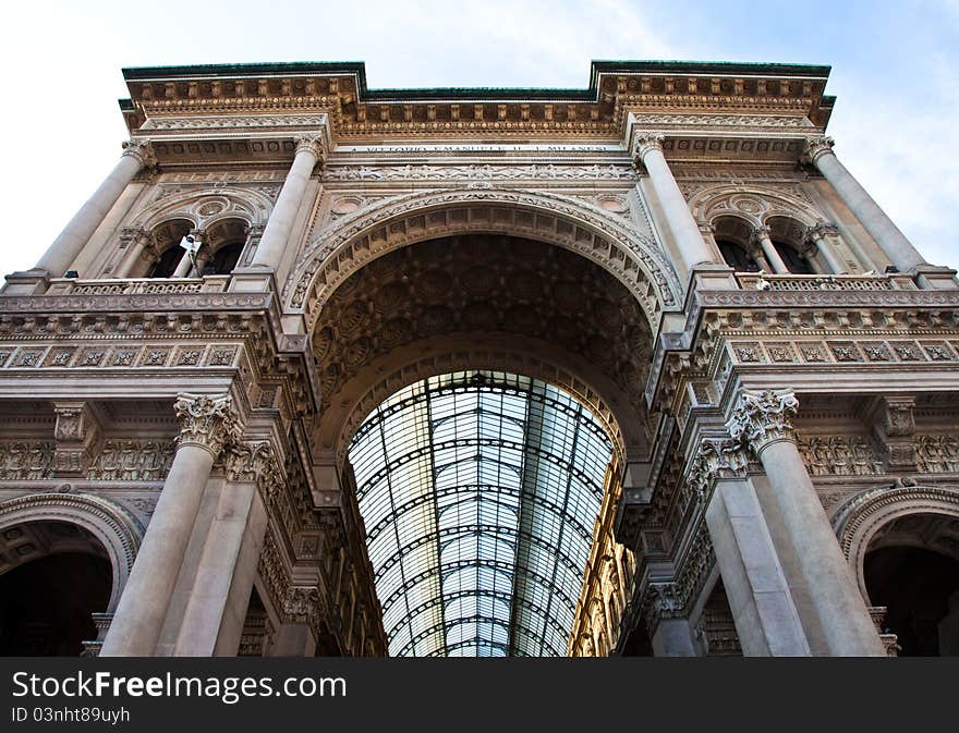 The Galleria Vittorio Emanuele II is a covered double arcade formed of two glass-vaulted arcades at right angles intersecting in an octagon, prominently sited on the northern side of the Piazza del Duomo in Milan. The Galleria Vittorio Emanuele II is a covered double arcade formed of two glass-vaulted arcades at right angles intersecting in an octagon, prominently sited on the northern side of the Piazza del Duomo in Milan.