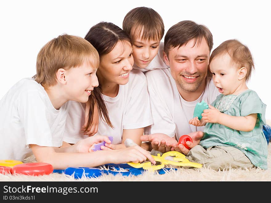 Cute family of a five on carpet