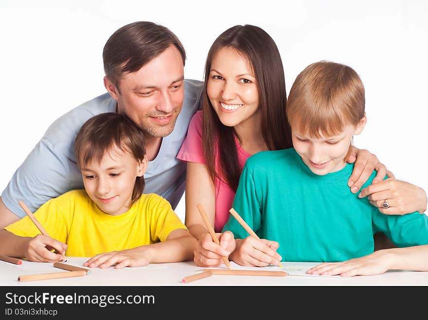 Family drawing at table