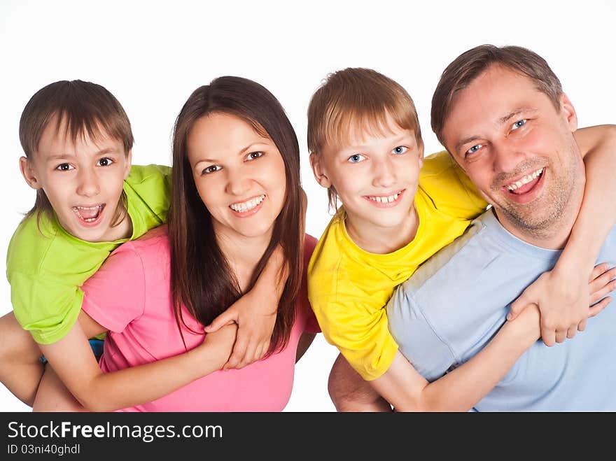 Happy family of a four smiling on white. Happy family of a four smiling on white