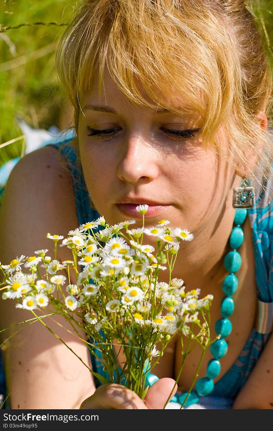 Girl with camomile flowers