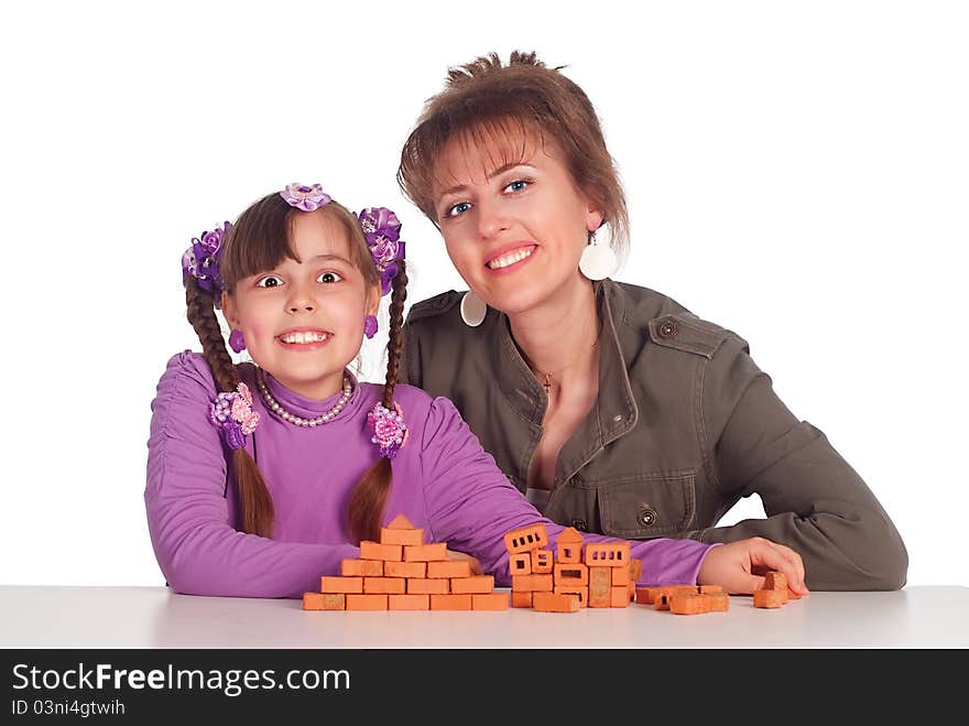 Cute mom plays with her little girl. Cute mom plays with her little girl