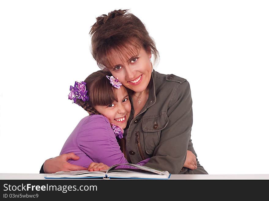 Mom and her daughter reading a book. Mom and her daughter reading a book