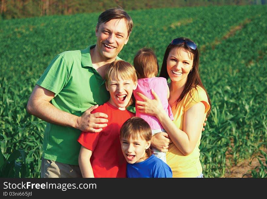 Cute family of a five at nature