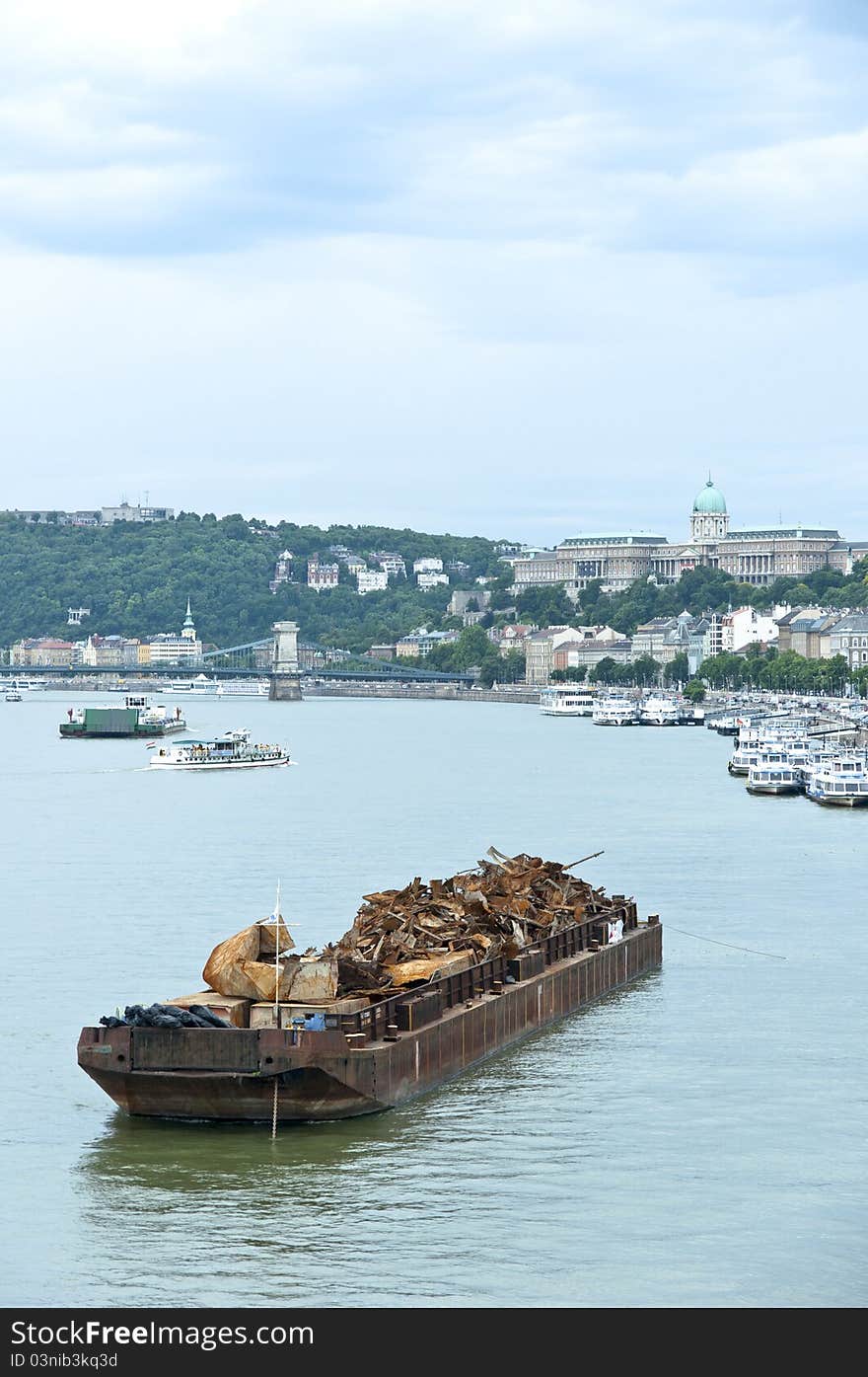 Boat with metal junk floating on water