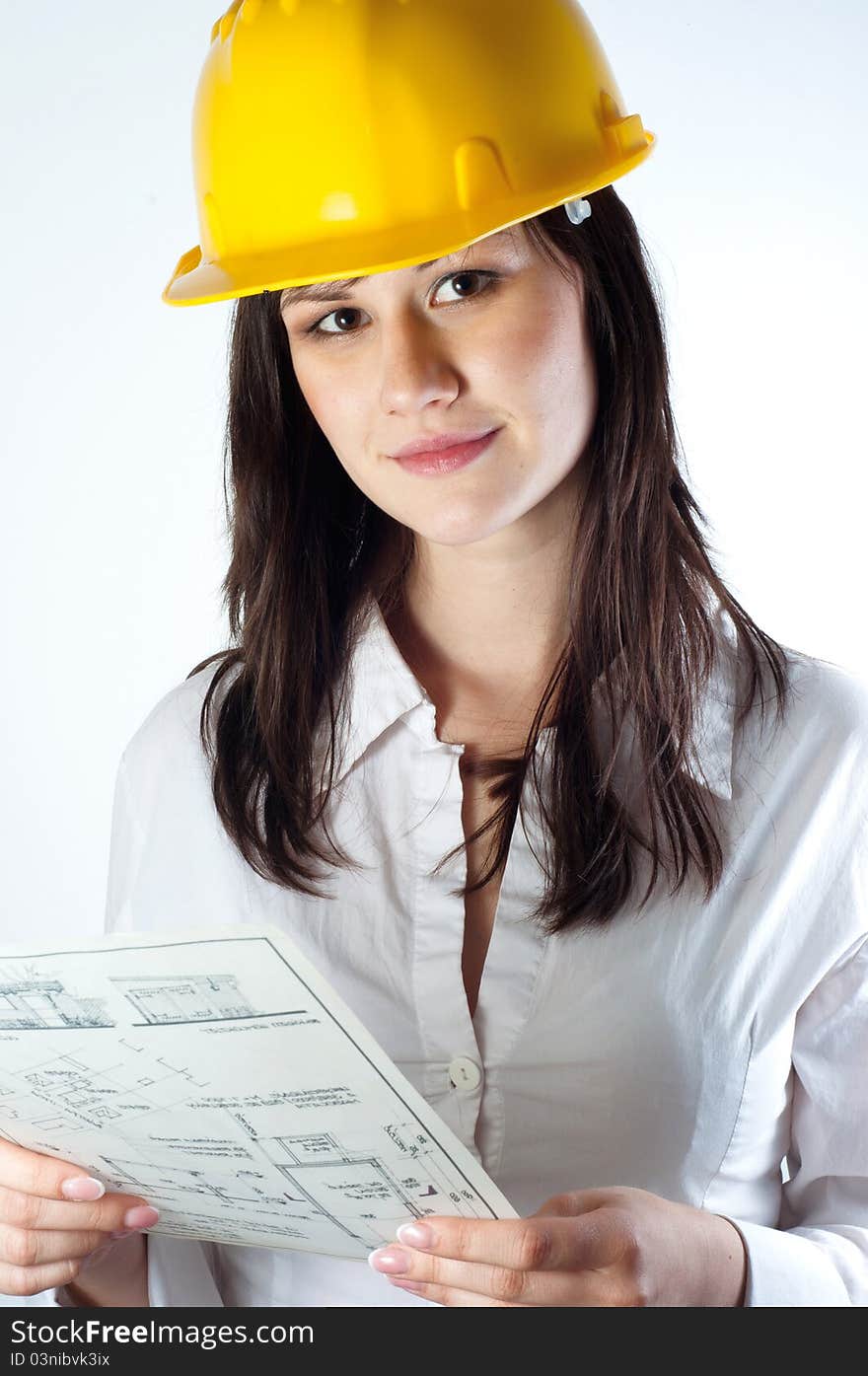 Beautiful business woman with construction plans