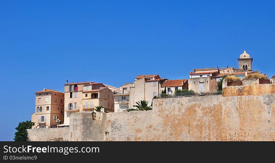 Village perched atop a Falas and surrounded by fortifications. Village perched atop a Falas and surrounded by fortifications