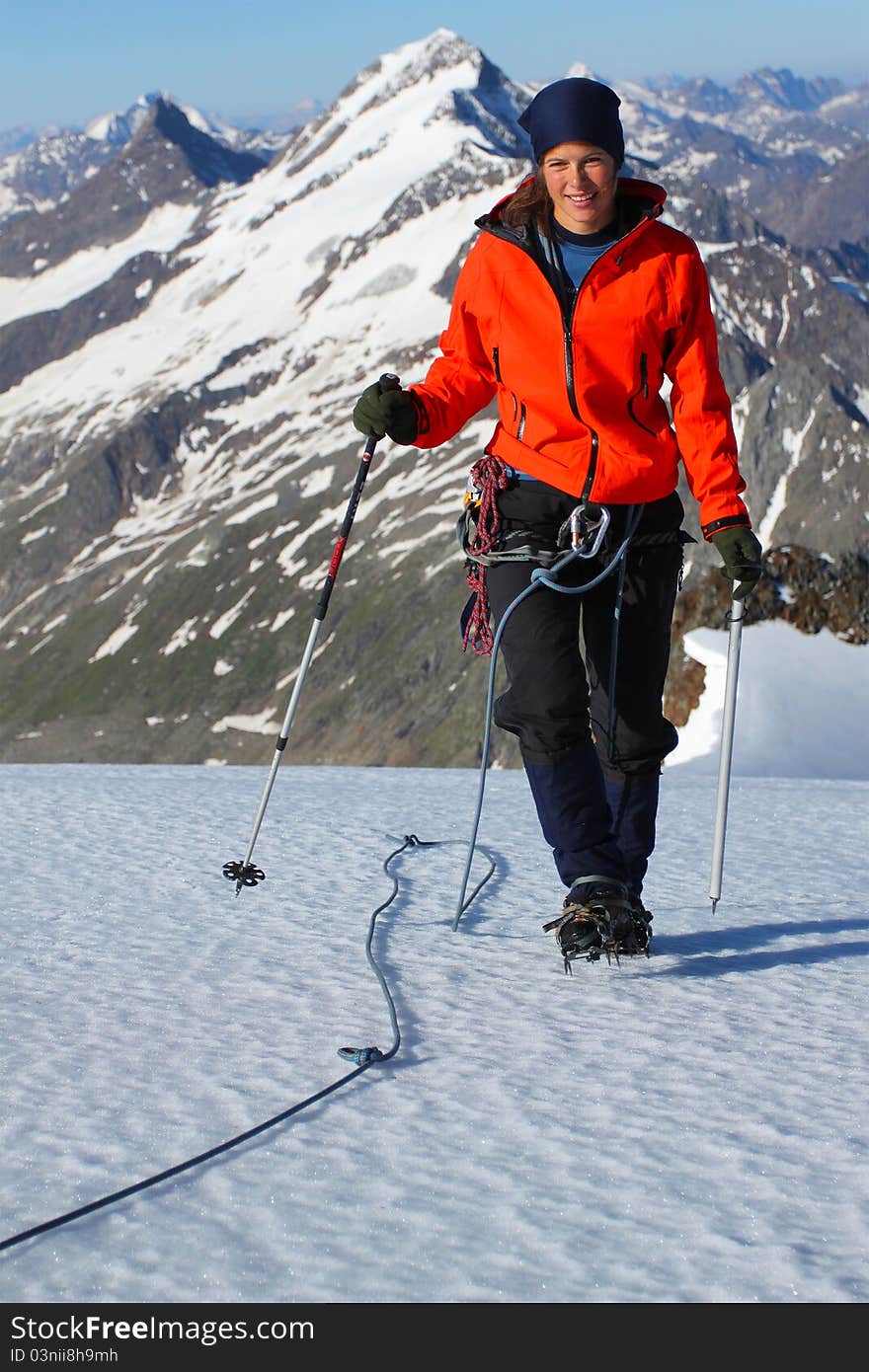 Climber ascending snow slope in the Austrian Alps. Climber ascending snow slope in the Austrian Alps