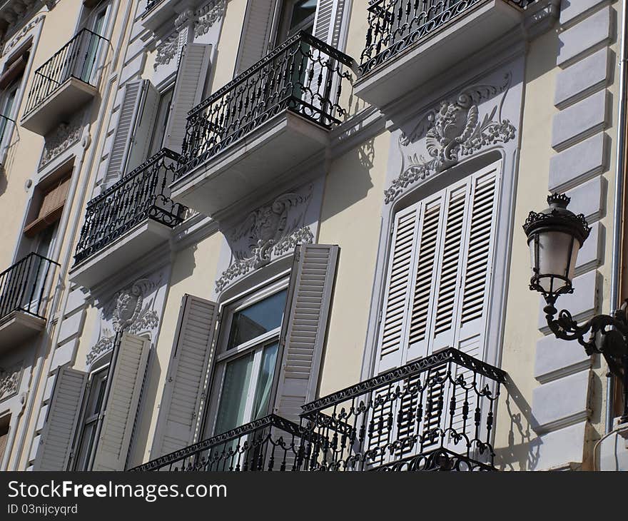 Balconies in a square in Granada in the midday sun. Balconies in a square in Granada in the midday sun.