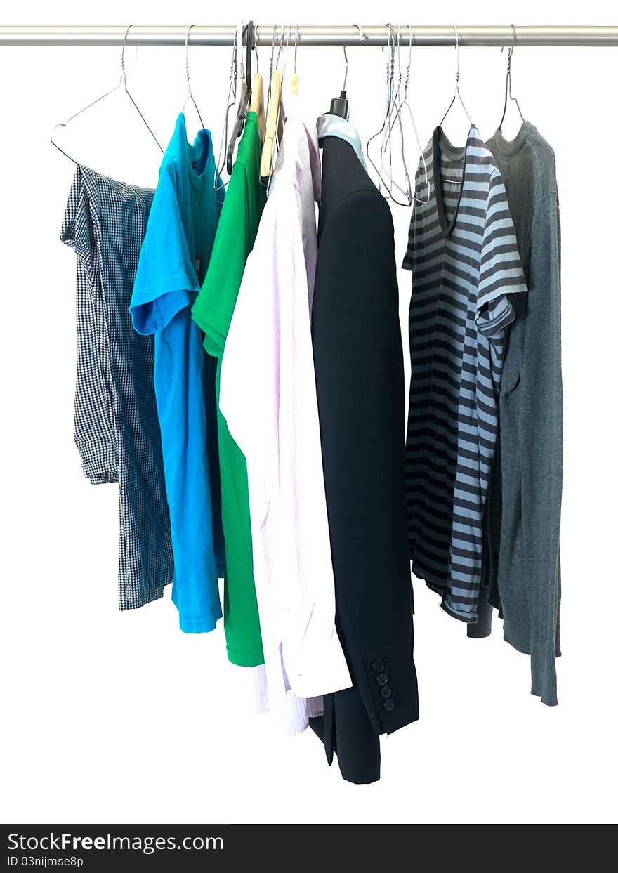 Garments hanging on coat hanger isolated against a white background. Garments hanging on coat hanger isolated against a white background