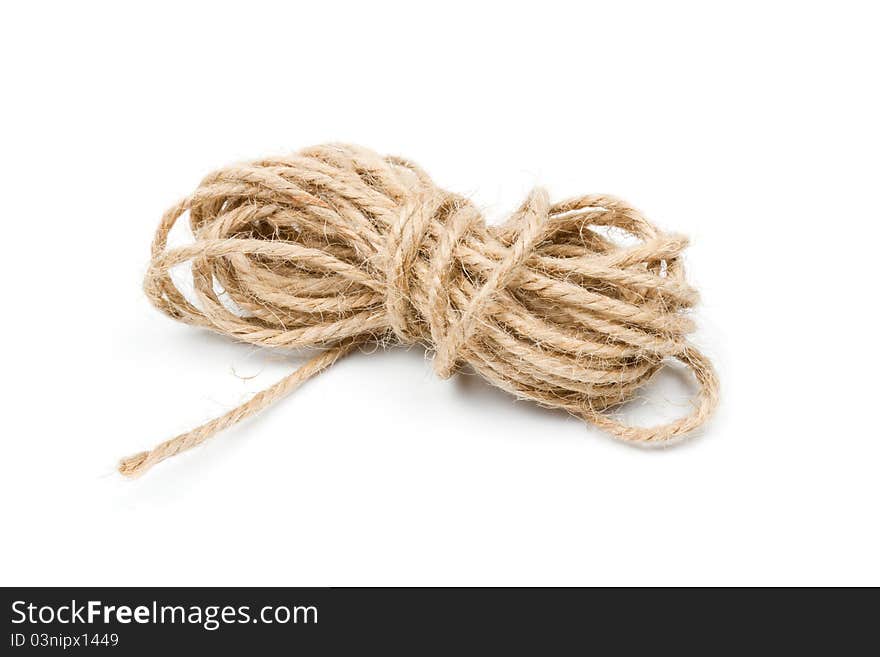Twine clew, rope, brown string on white. Twine clew, rope, brown string on white