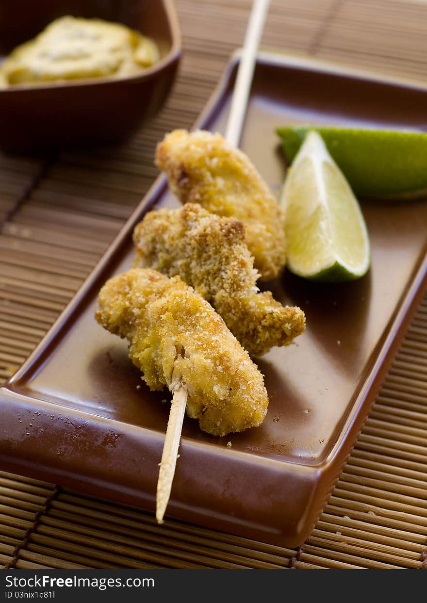 Fresh chicken nuggets with mustard sauce. Selective focus