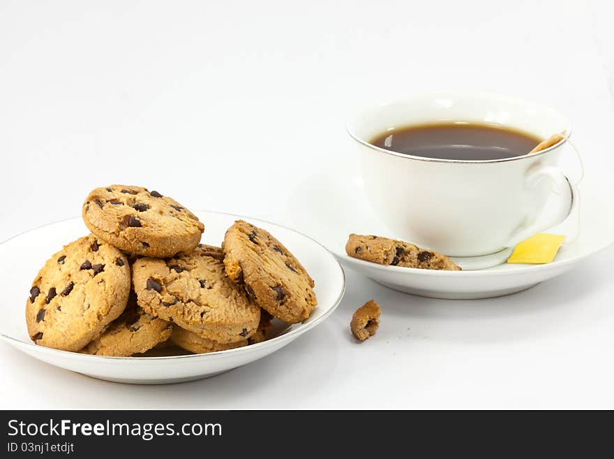 Cookies and a cup of tea on white background. Cookies and a cup of tea on white background