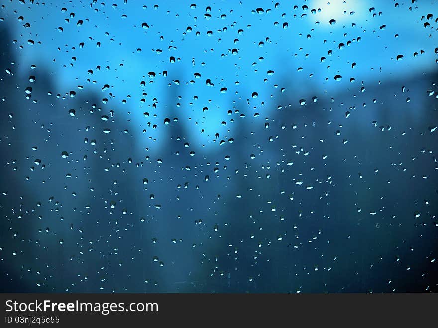 Rain drops on a blue window. Rain drops on a blue window