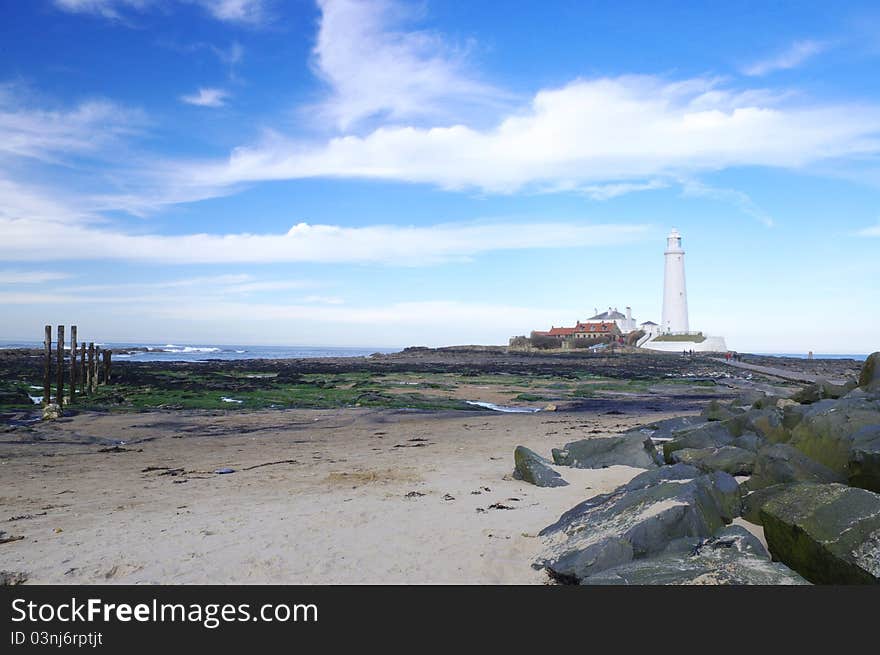 The lighthouse in perspective to the beach. The lighthouse in perspective to the beach