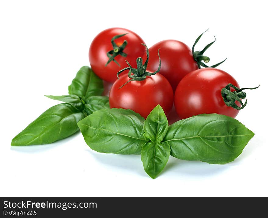 Leaves of basil and tomatoes