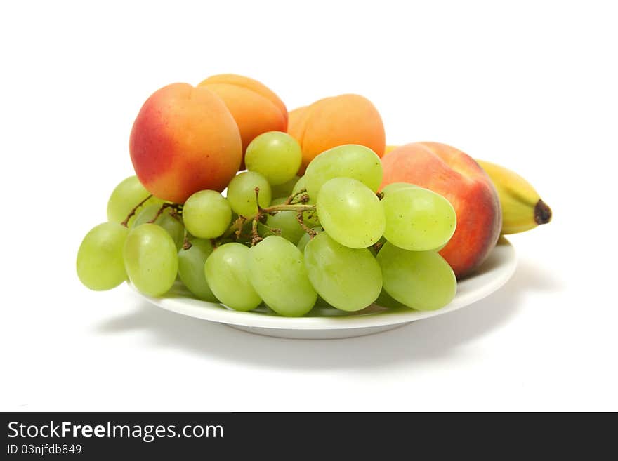 Close-up of fruits on white plate