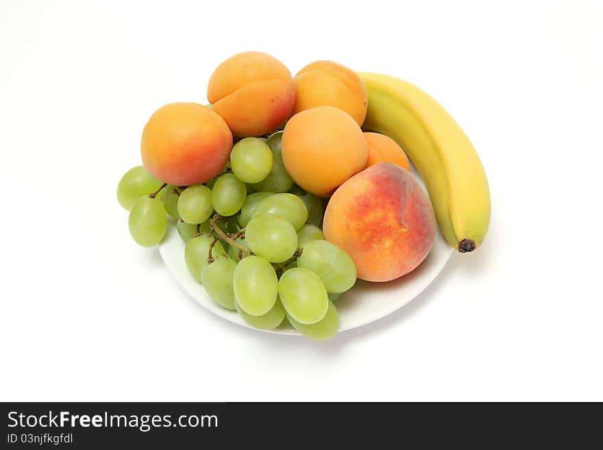 Close-up of fruits on white plate