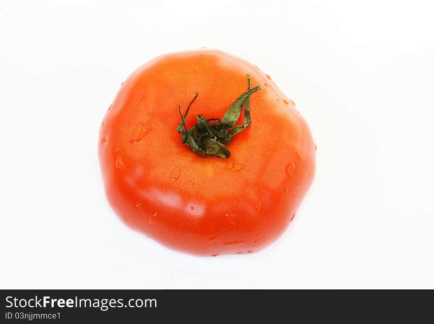 Red tomato over white background