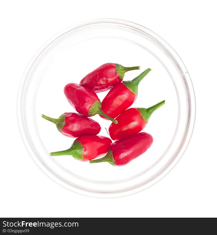 Red pepper portion in glass bowl on white