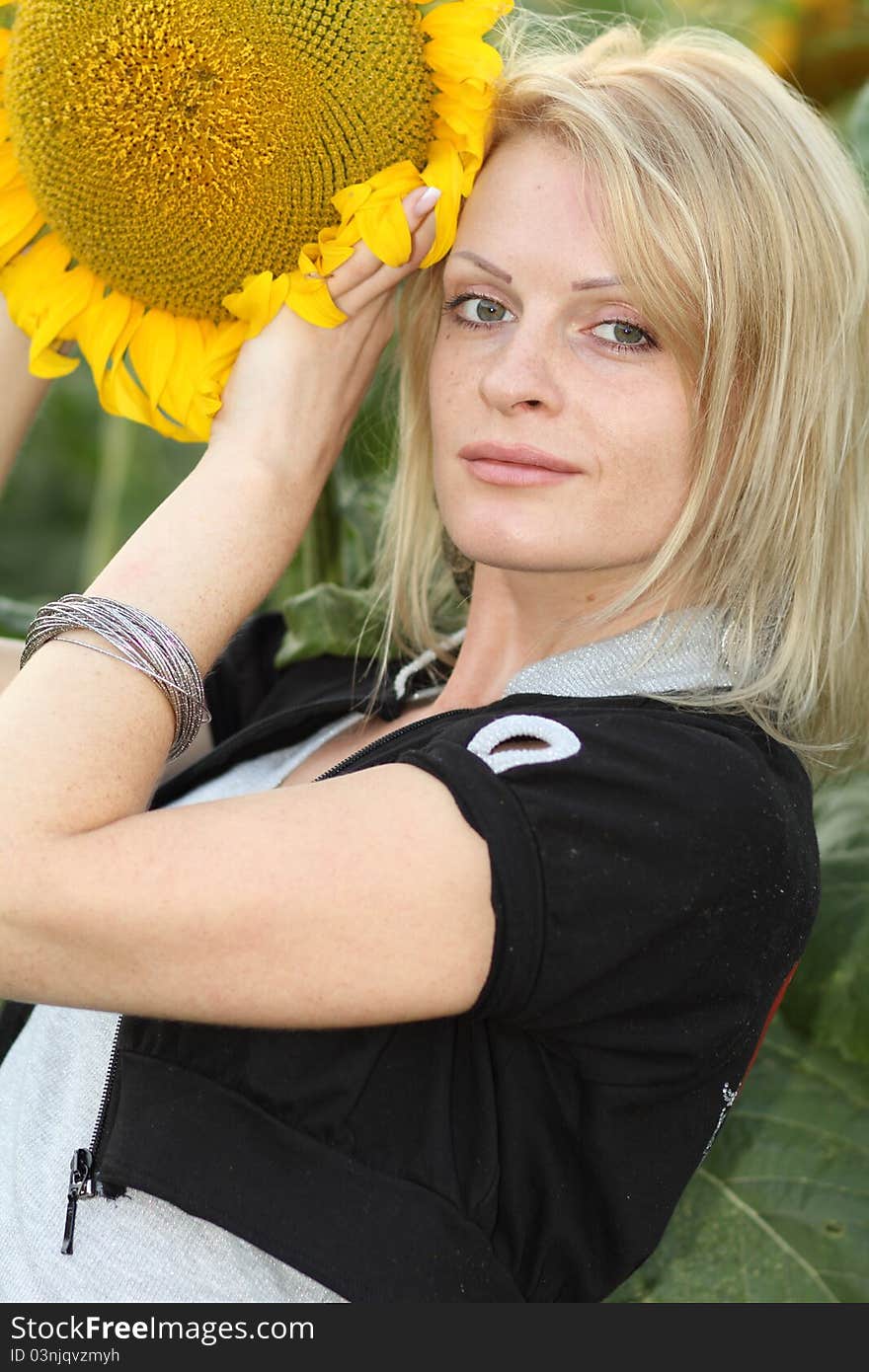 Beauty woman and sunflowers