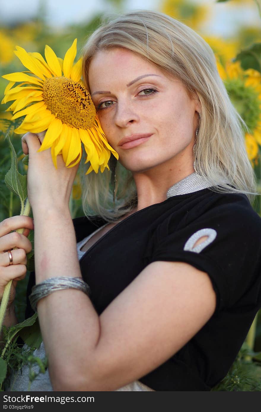 Beauty Woman And Sunflowers