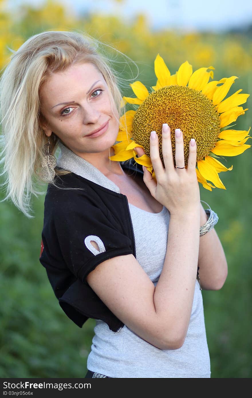 Beauty woman and sunflowers