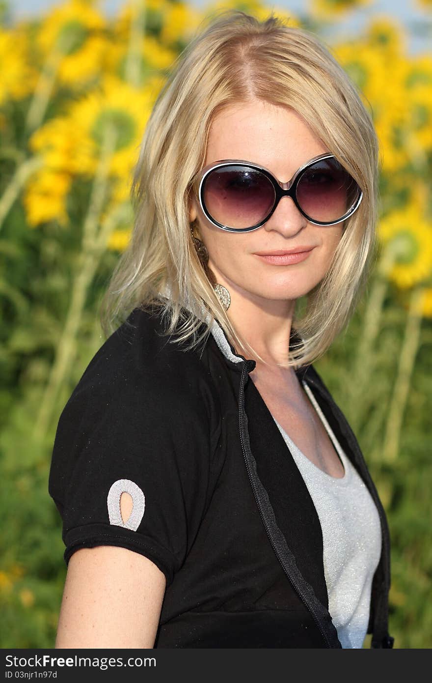 Beauty woman and sunflowers