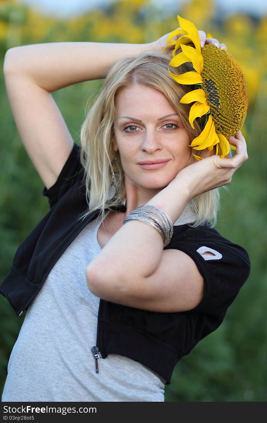 Beauty woman and sunflowers