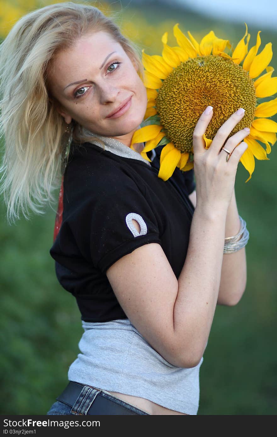 Beauty Woman And Sunflowers